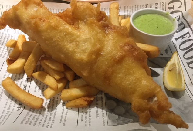 Battered cod, chips, mushy peas and a wedge of lemon