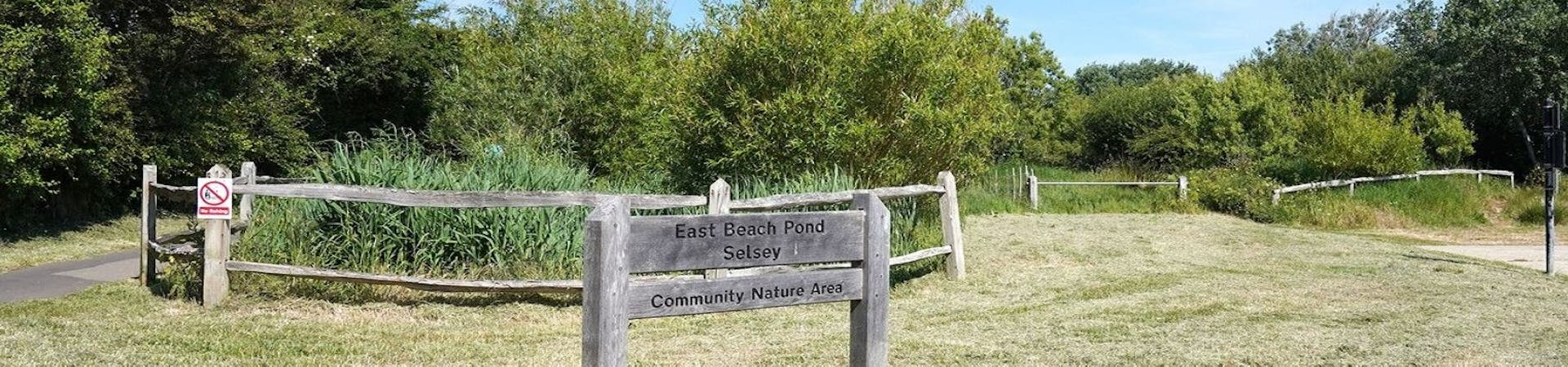 Wooden sign to East Beach Pond Selsey a community nature area