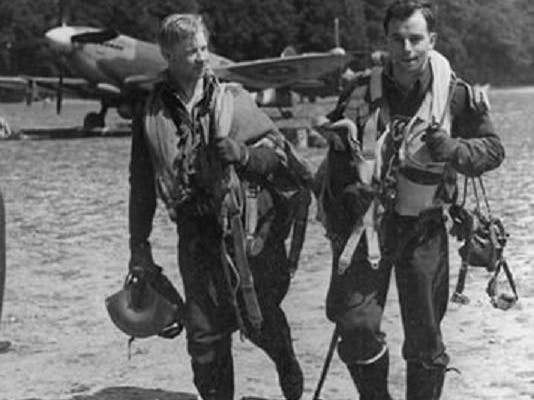 Image of pilots on the RAF Selsey airfield from June 1944 with spitfire in the background