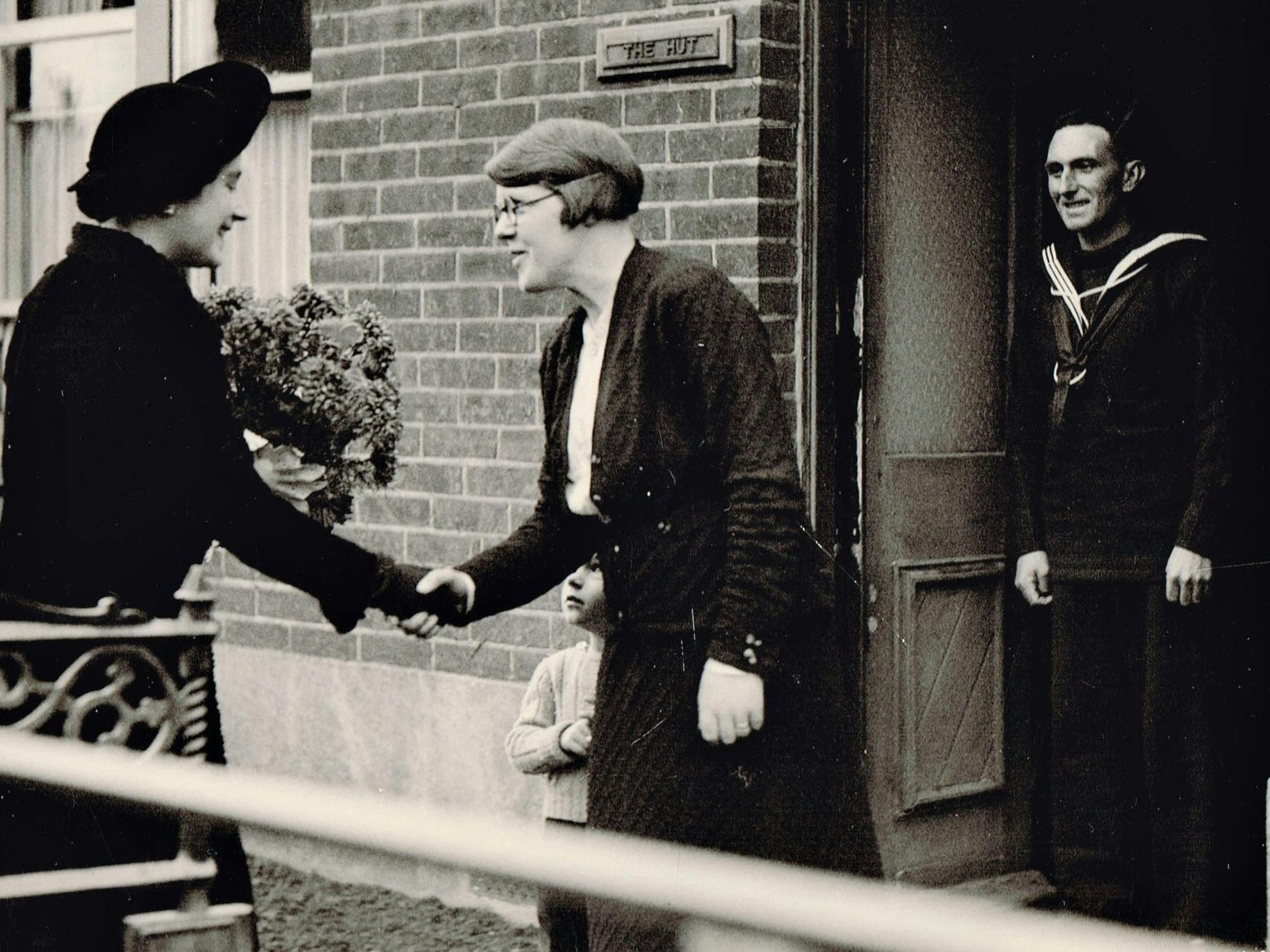 Queen Elizabeth, Queen Mother meeting Ken and Bess Maidment and son in North Road 