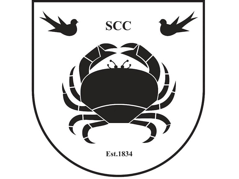 Selsey Cricket Club Logo Selsey Cricket Club Logo comprising of a shield featuring one central large crab and two small birds.