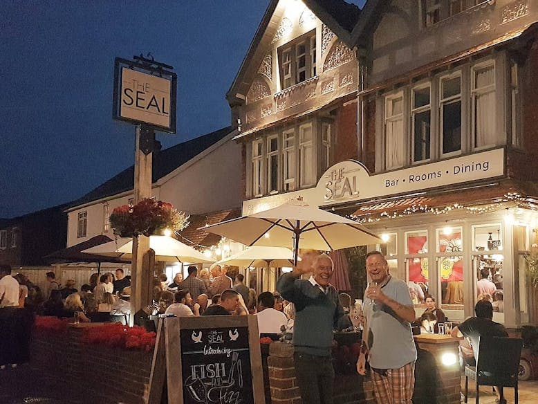 The Seal  People enjoying the evening at The Seal public house in the front terraced area