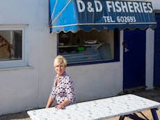 Mary Arnell outside her fresh seafood kiosk at East Beach