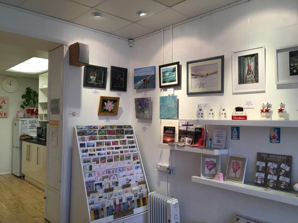 Inside the shop showing its kitchen in the background and craft offerings in the foreground