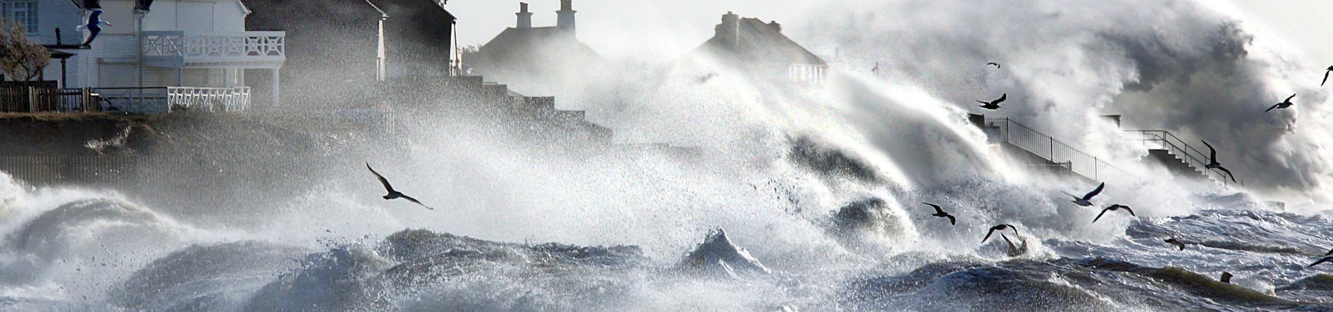 Storm Eleanor forces the waves to batter against the houses on the sea front at Selsey