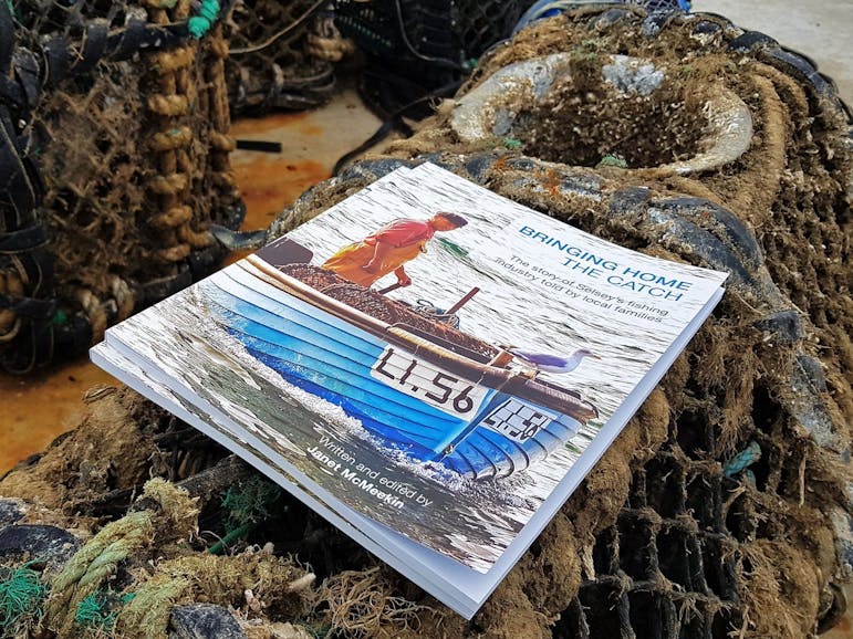 Bringing Home the Catch, courtesy of Jane Cunningham,Sea's the Day Image of the Bringing Home the Catch publication placed on a prawn pot