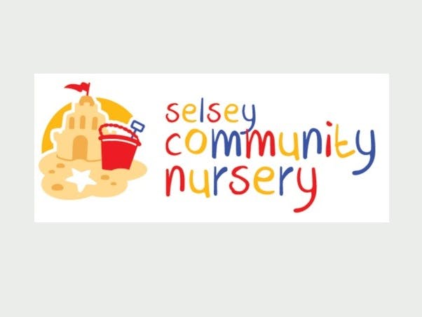 Selsey community nursery logo made up of a sandcastle and red bucket with a multi coloured red, yellow and blue writing spelling out their name