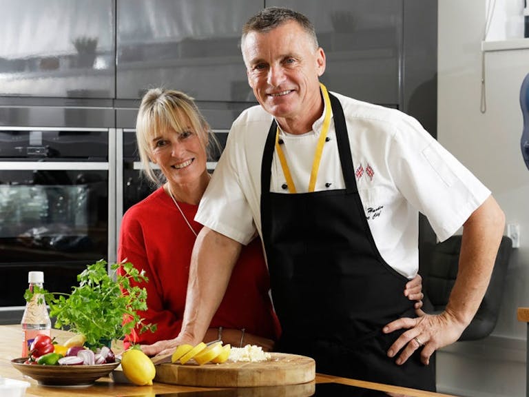 Tom and Debbie of Umble Pies photo of Tom and Debbie of Umble Pies in their kitchen