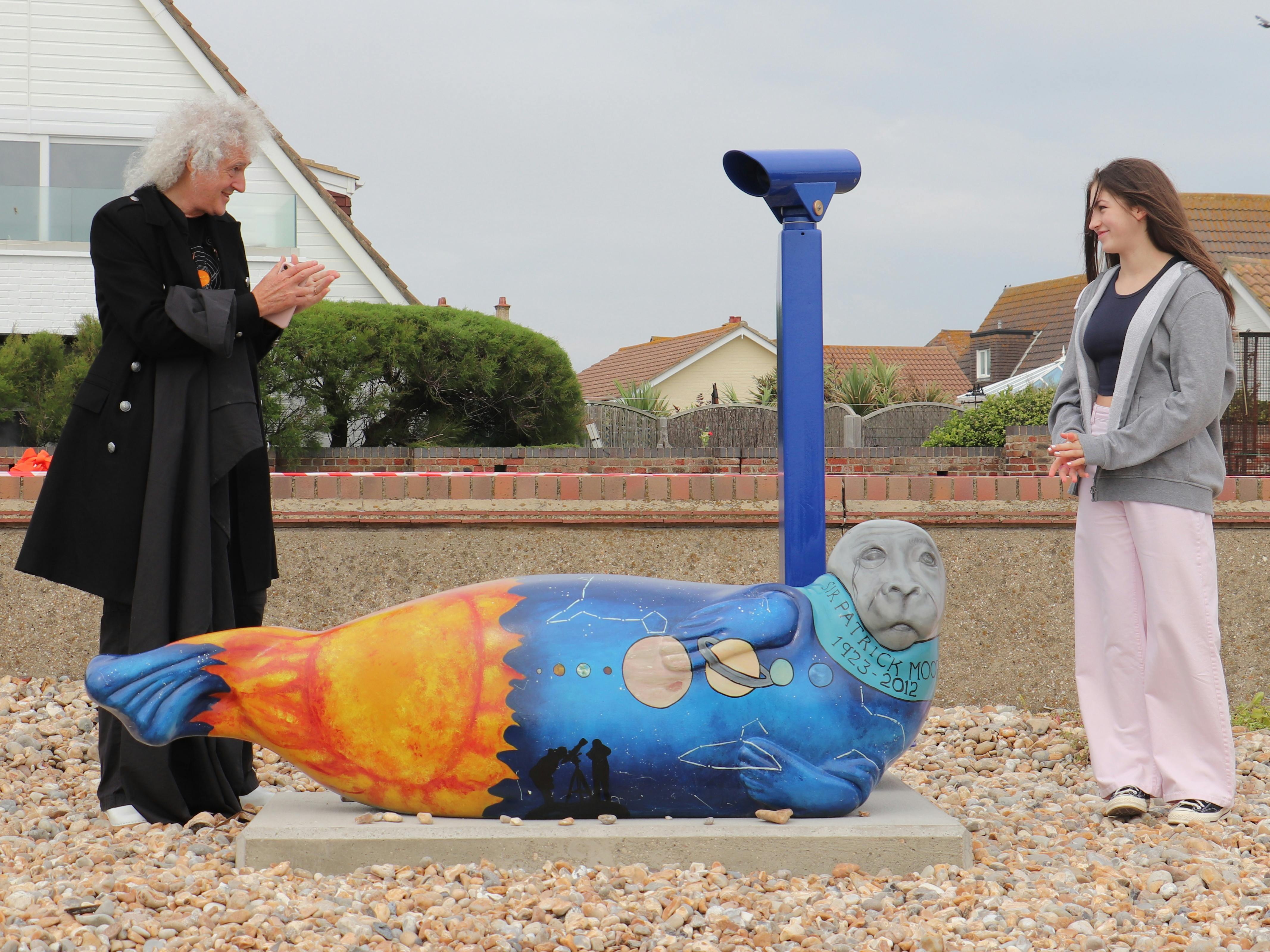 Sir Patrick Moore and Selsey's Dark Skies Seal, by Art Student Megan Masters with Dr Brian May