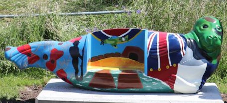 Painted fiberglass seal with remembrance imagery. Designed by Nicolas Binns and Ruby Moffatt.