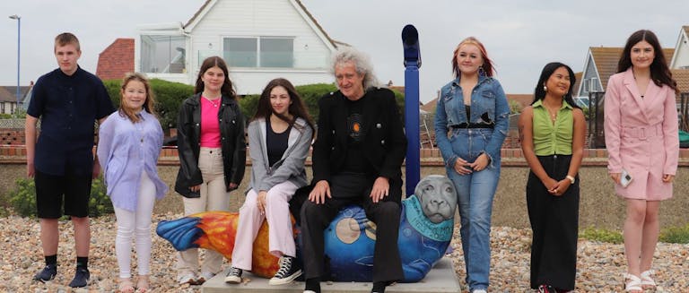 Seven Selay Seal Art Trail designers pictured alonside Dr. Brian May who unveiled the Dark Skies Seal.