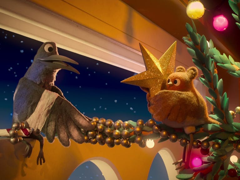 Robin Robin courtesy of Aardman Animation Cartoon robin giving a star christmas decoration to a pigeon