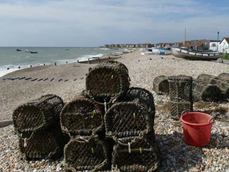 East Beach, Selsey, West Sussex The working area of East Beach, Selsey, West Sussex, featuring lobster pots and fishing boats