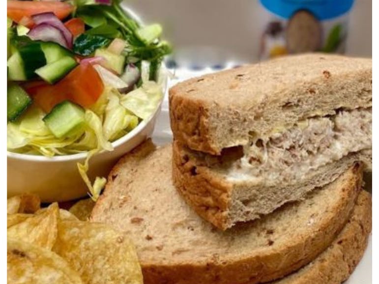The Old Piggery Crab Sandwich Photograph of a crab sandwich with side salad and crisps