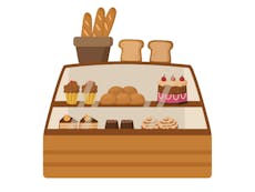 Illustration of a bakery counter with bread and cakes