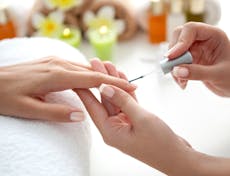Photograph of finger nails being painted