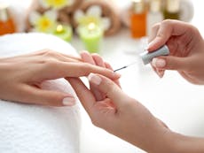 Photograph of finger nails being painted