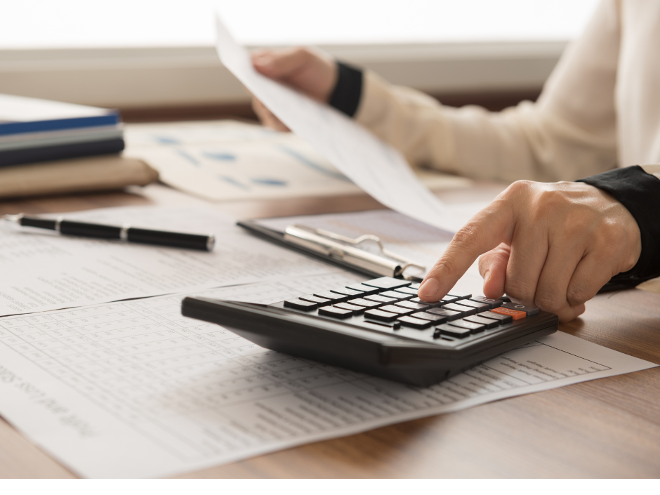 Photograph of paperwork and a calculator