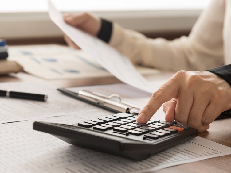 Photograph of paperwork and a calculator