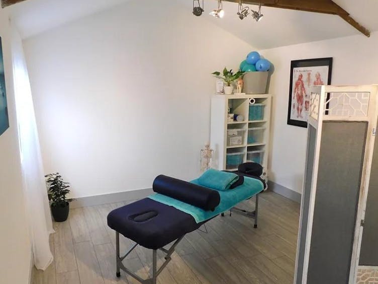 Photograph of a massage table in a room