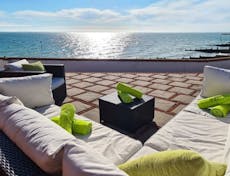 Photograph of an outside seating area with sea views