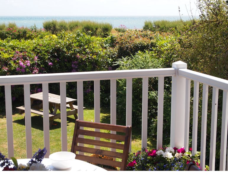 Turnstiles Photograph showing a garden overlooking the sea