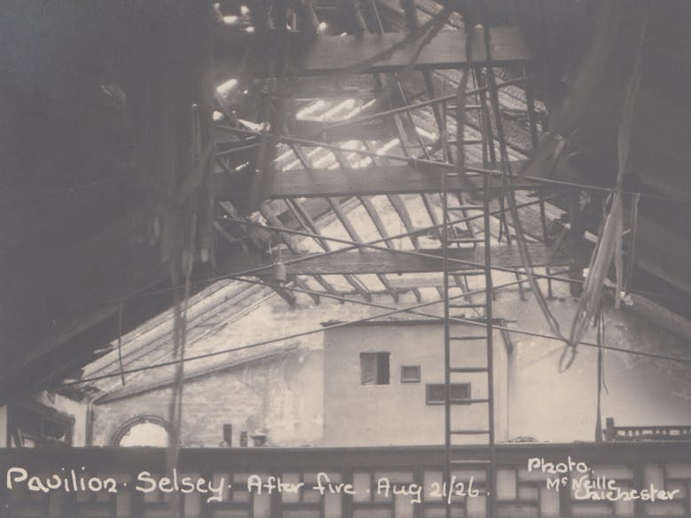 The Aftermath of the 1926 Fire at the Selsey Pavilion Image of the burnt out Pavilion following the fire in 1926 which includes the burnt out roof and rafters