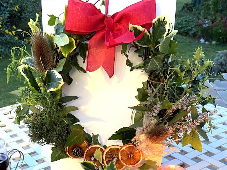 Christmas Wreath Courtesy of RSPB Pagham Chrismas wreath with dried orange slices, red ribbon and thistle tufts