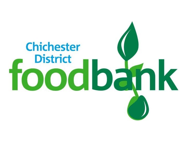 Chichester District Foodbank Logo with blue writing for Chichester District, light green for "food" dark green for the word 'bank' with a seedling under the a and n of 'bank'