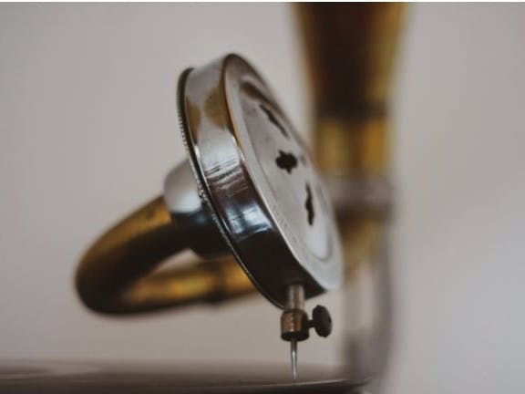 Close up image of a gramaphone needle on a record