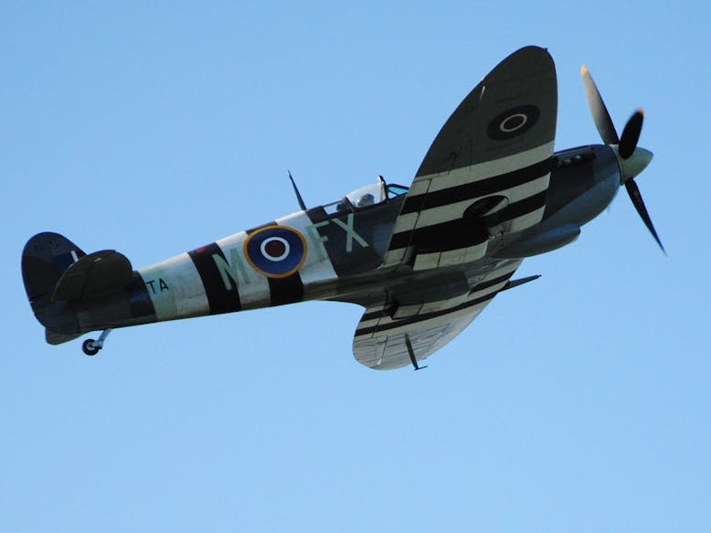 Spitfire with D-Day Landing Stripes courtesy of Cllr. Pieter Montyn Image of a spitfire plane with the D-Day landing stripes