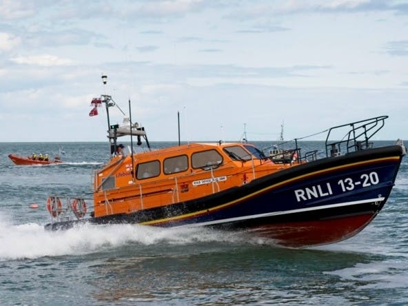 Photograph of Shannon Lifeboat and smaller lifeboat vessel at sea off Selsey