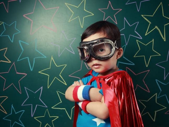 Super Senses courtesy of real444 from Getty Images Signature on canva.com photography of a child dressed as a superhero