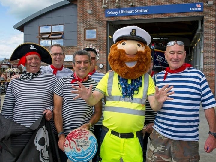 photograph of Selsey Shantymen with RNLI Mascot courtesy of RNLI Selsey