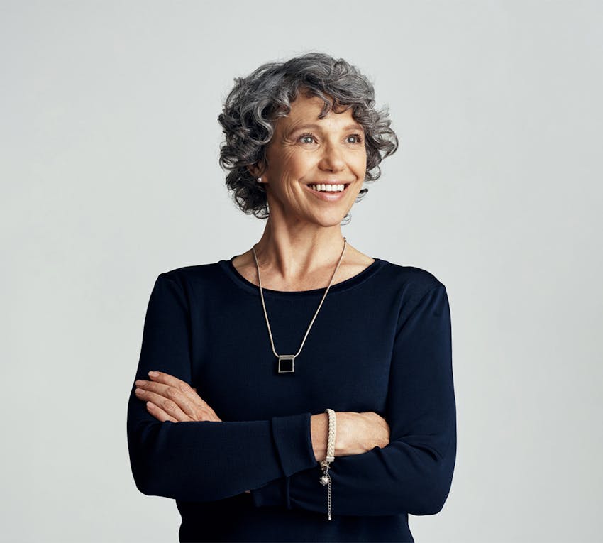 smiling woman crossing her arms