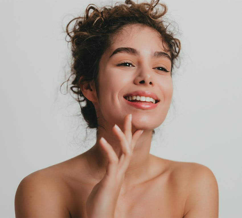 model holding her face
