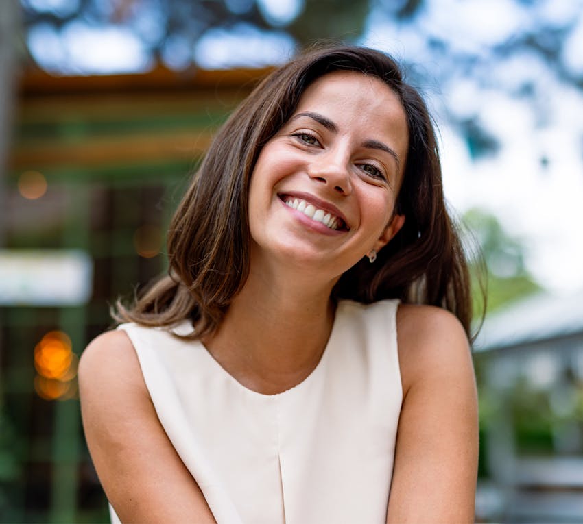 women smiling outside