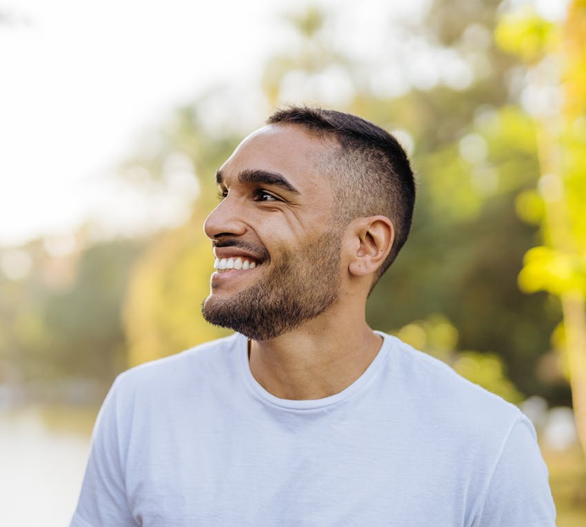 man smiling to the side