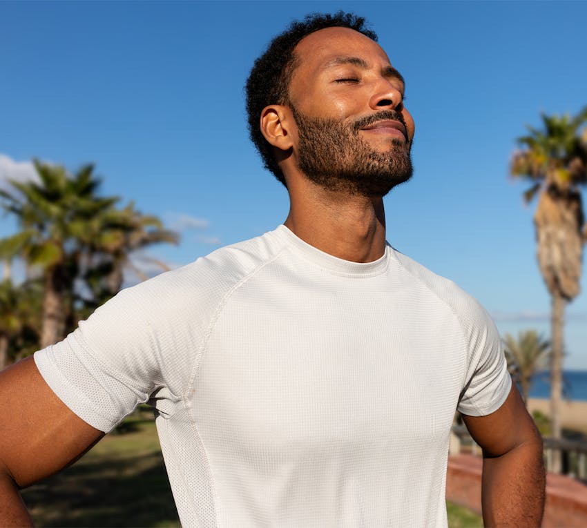 man with his eyes closed tilting his head up