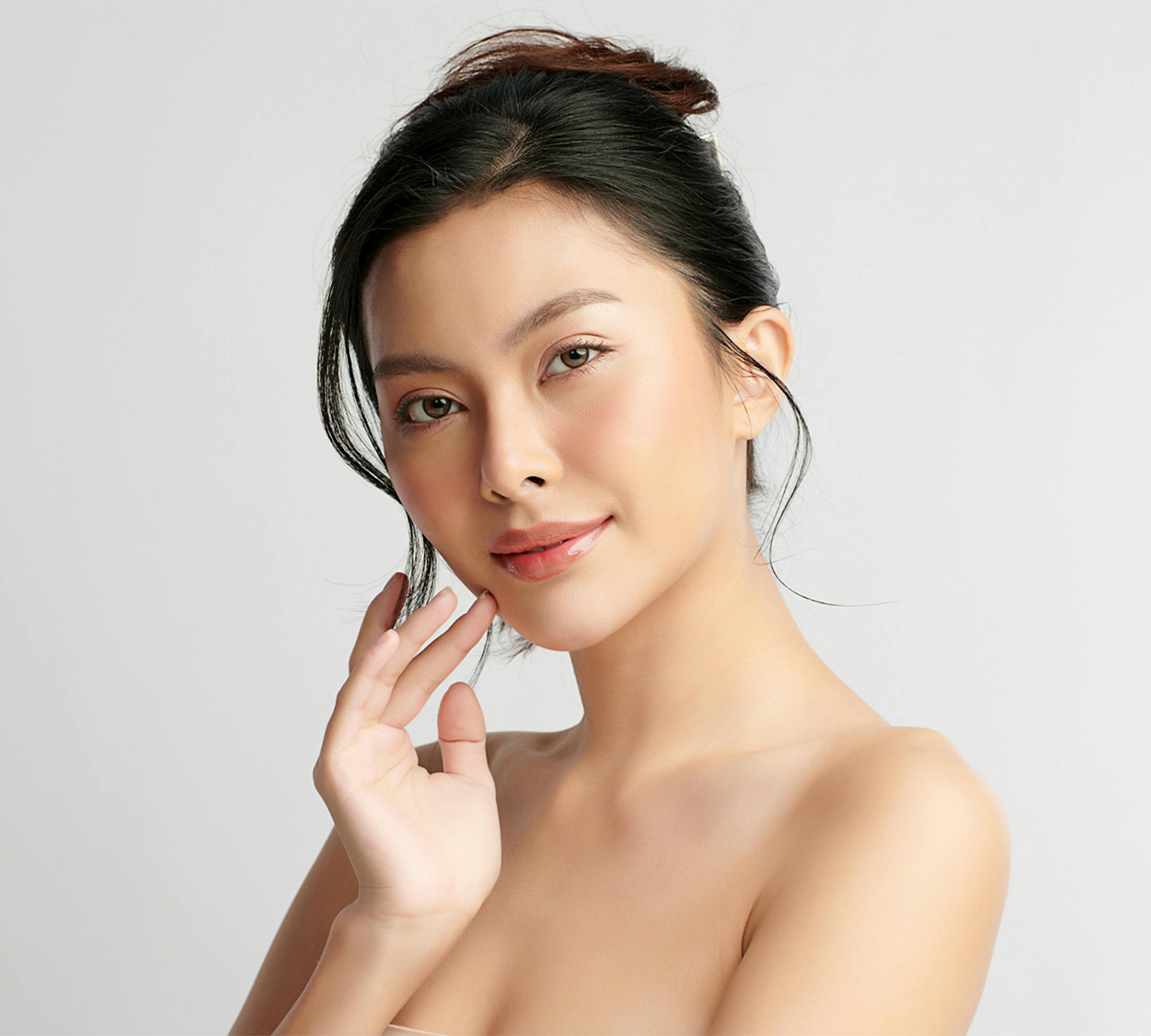 Woman touching her chin
