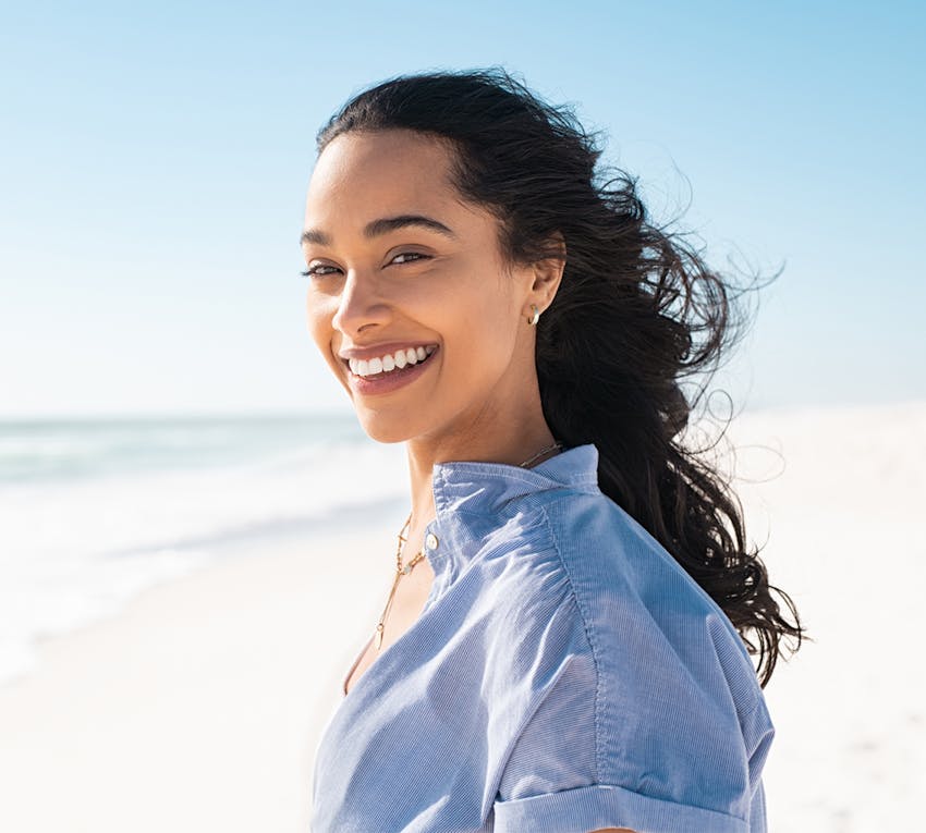 woman smiling over her shoulder