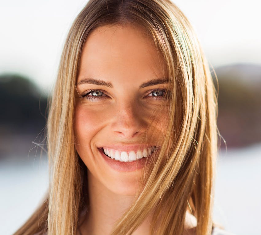 women smiling into camera
