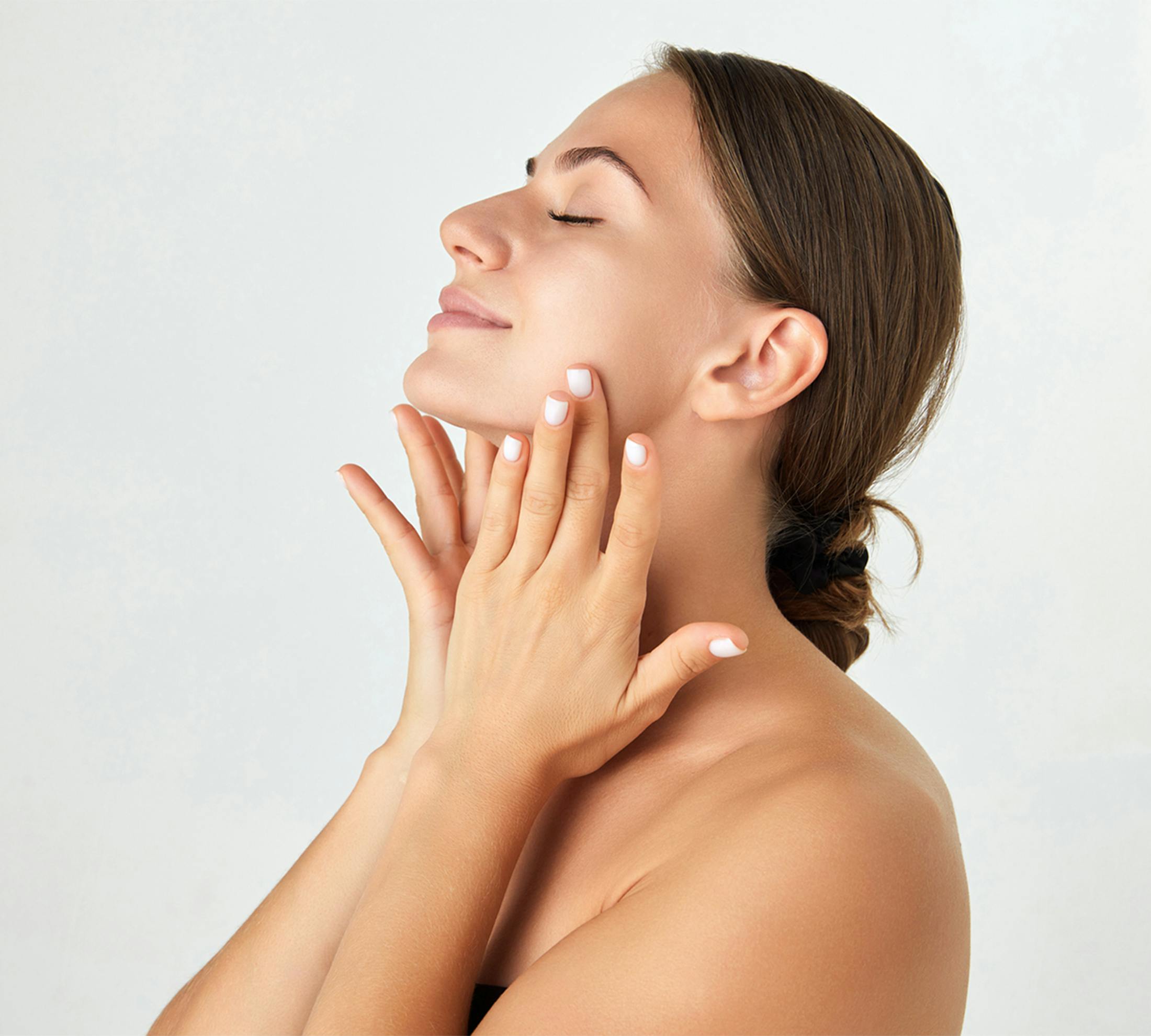 Woman touching her face