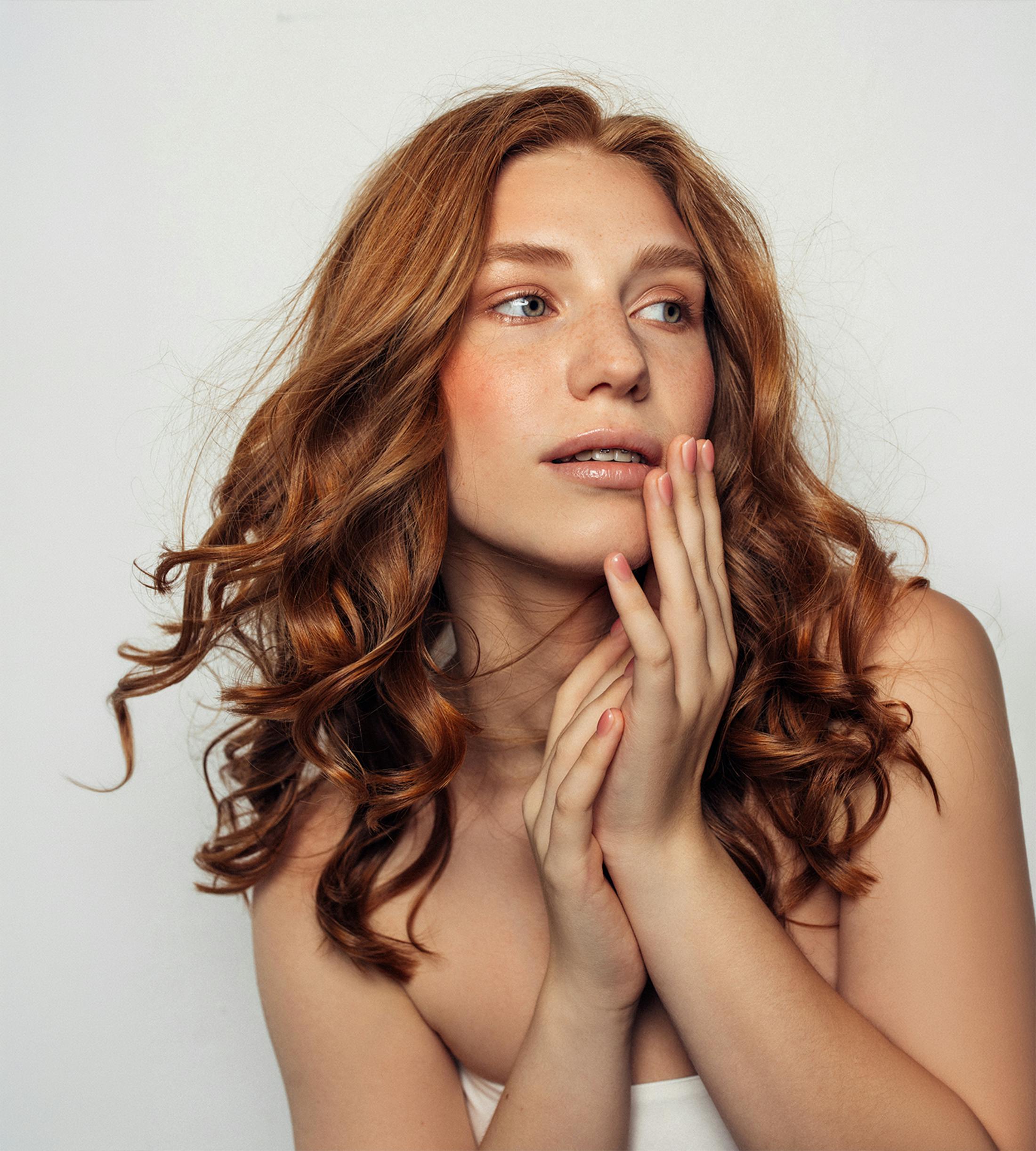 Woman touching her cheek