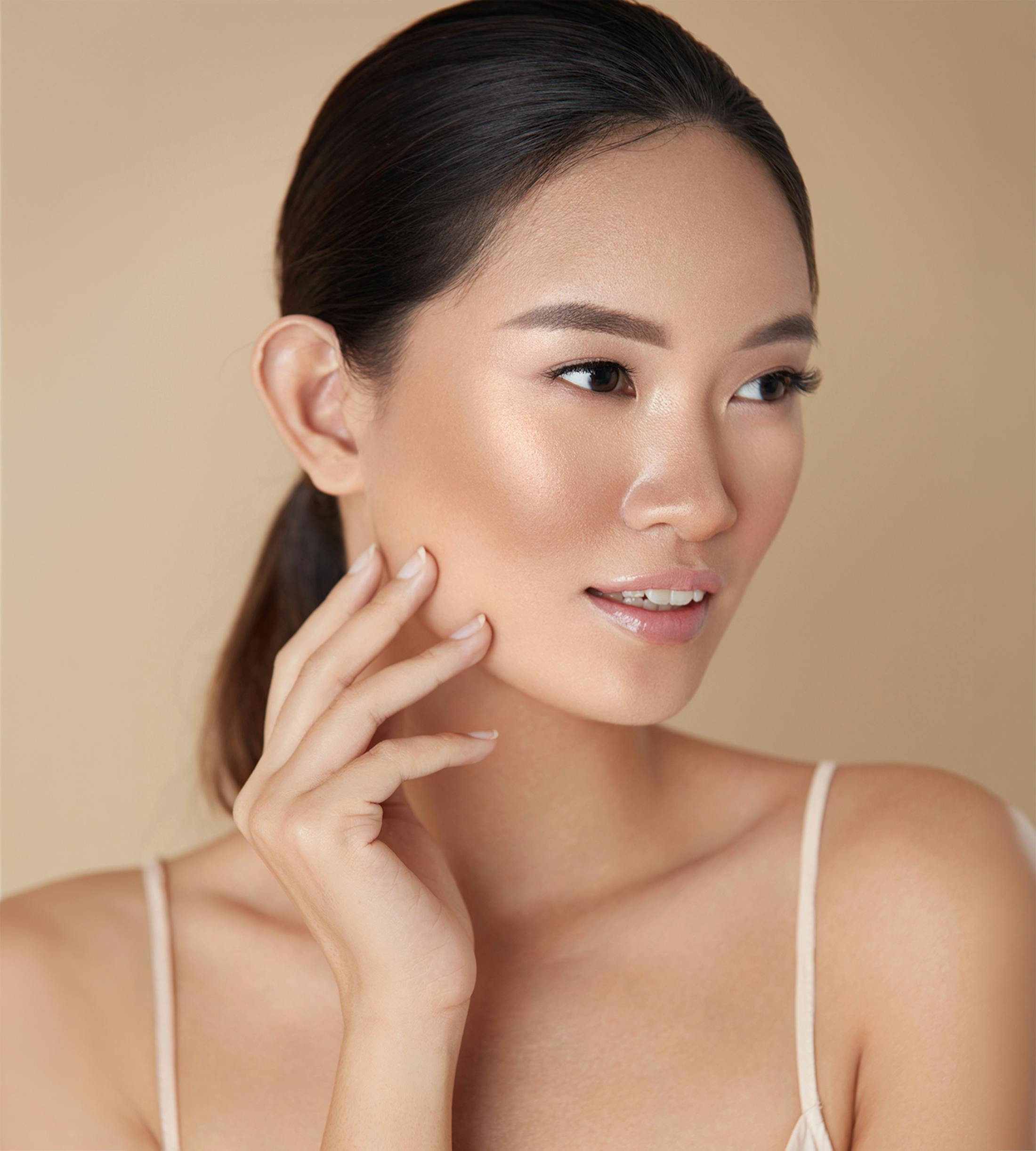 Woman touching her face