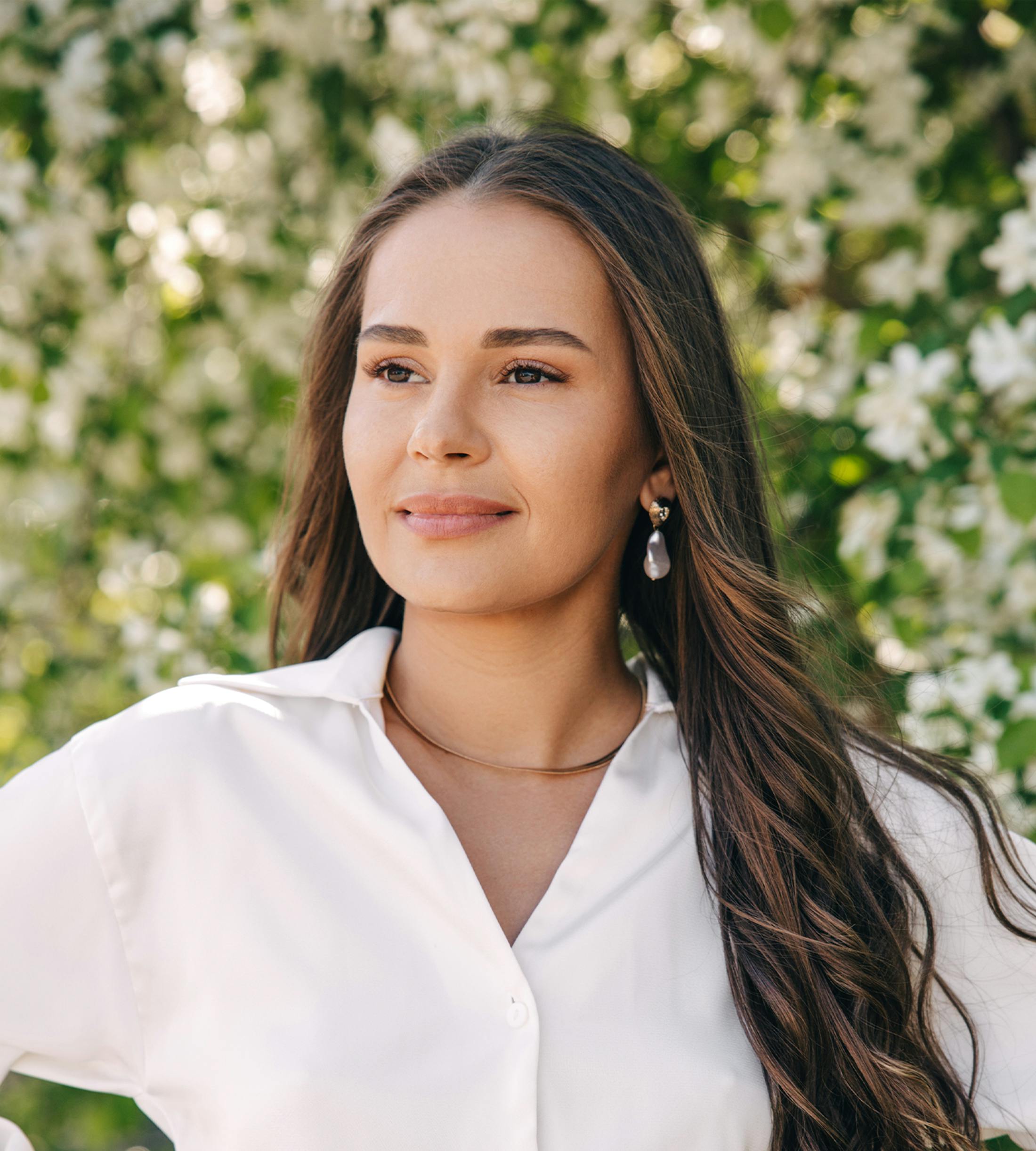 woman infront of flowers