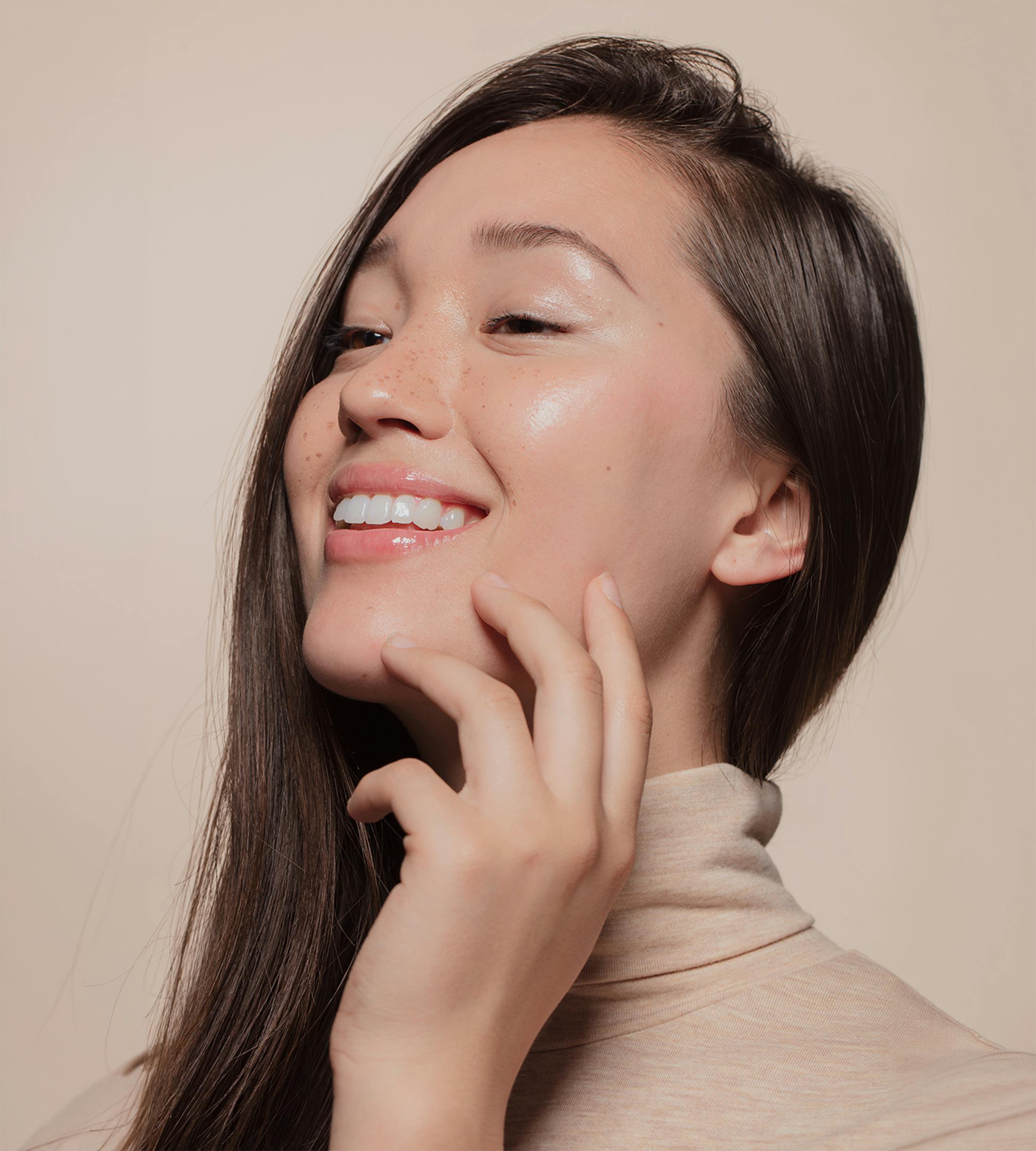 woman touching her face