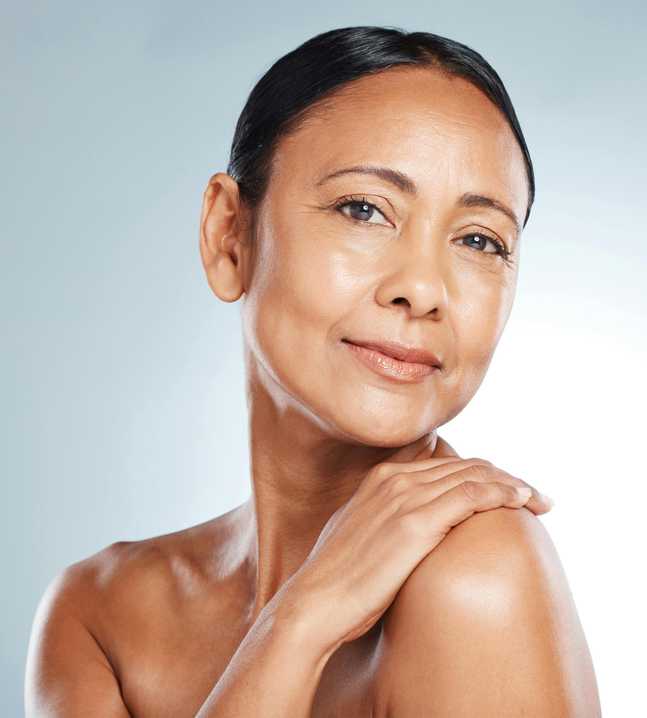 woman touching her shoulder