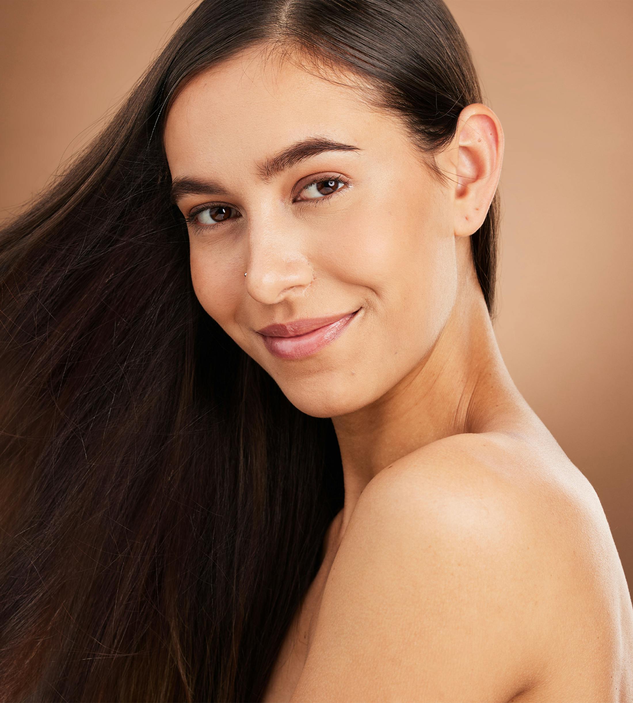 woman smiling over her shoulder