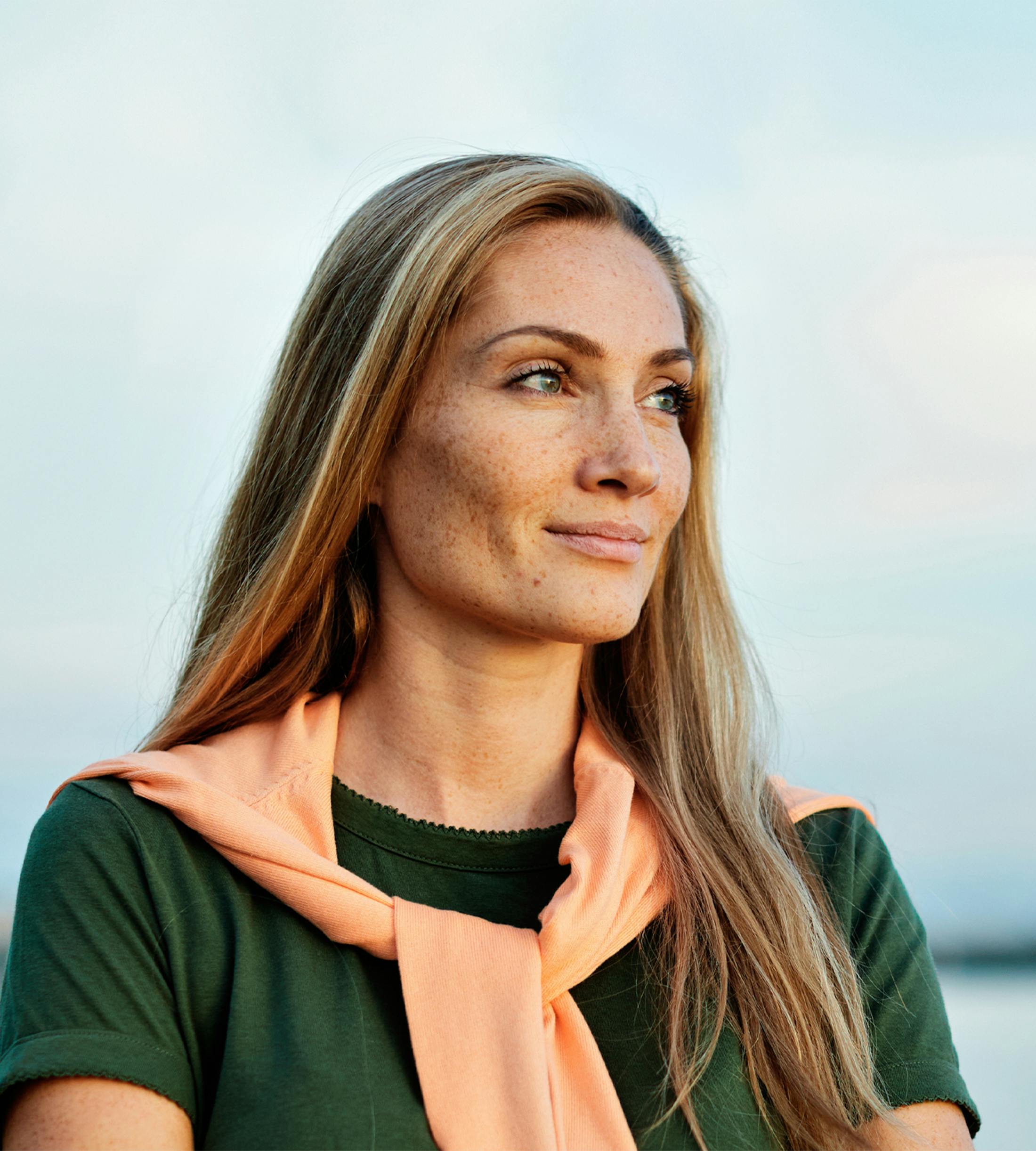 woman smiling to the side